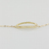 9k yellow gold bracelet with open oblong in white cz